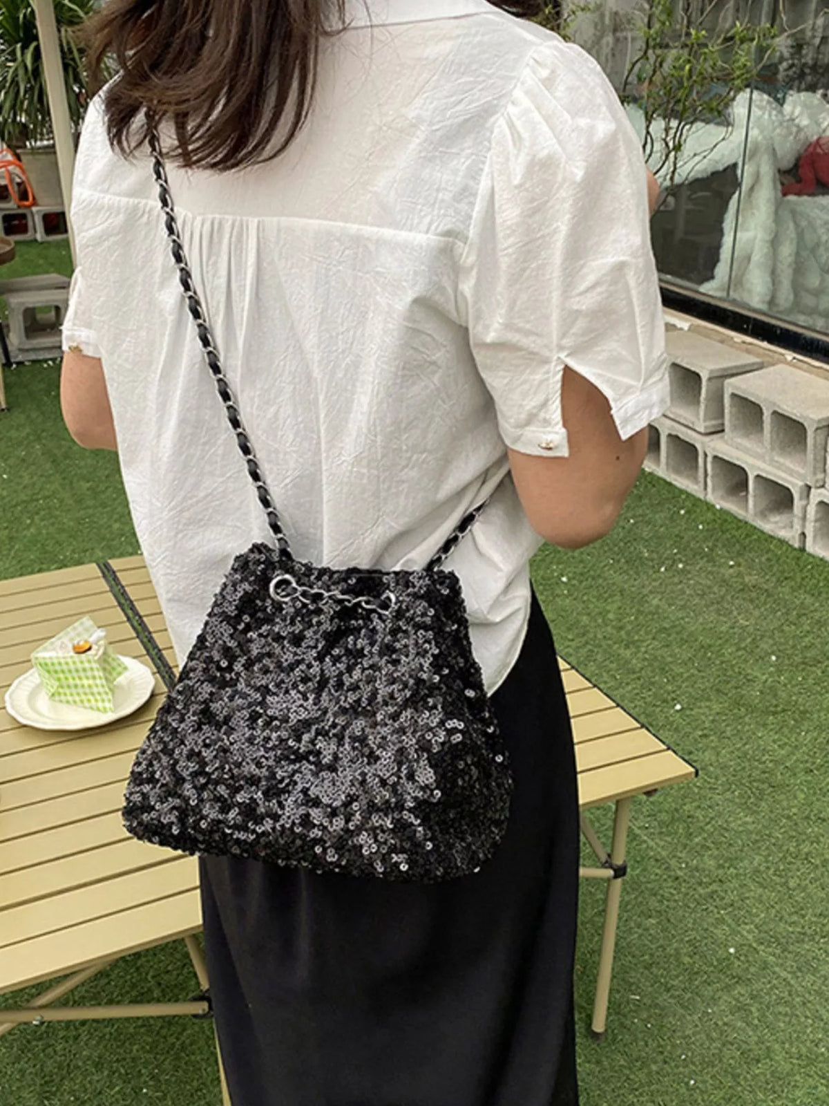 Sequin bucket bag in black front view