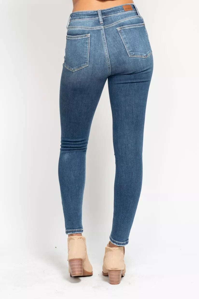 Close up of medium wash denim and stitching