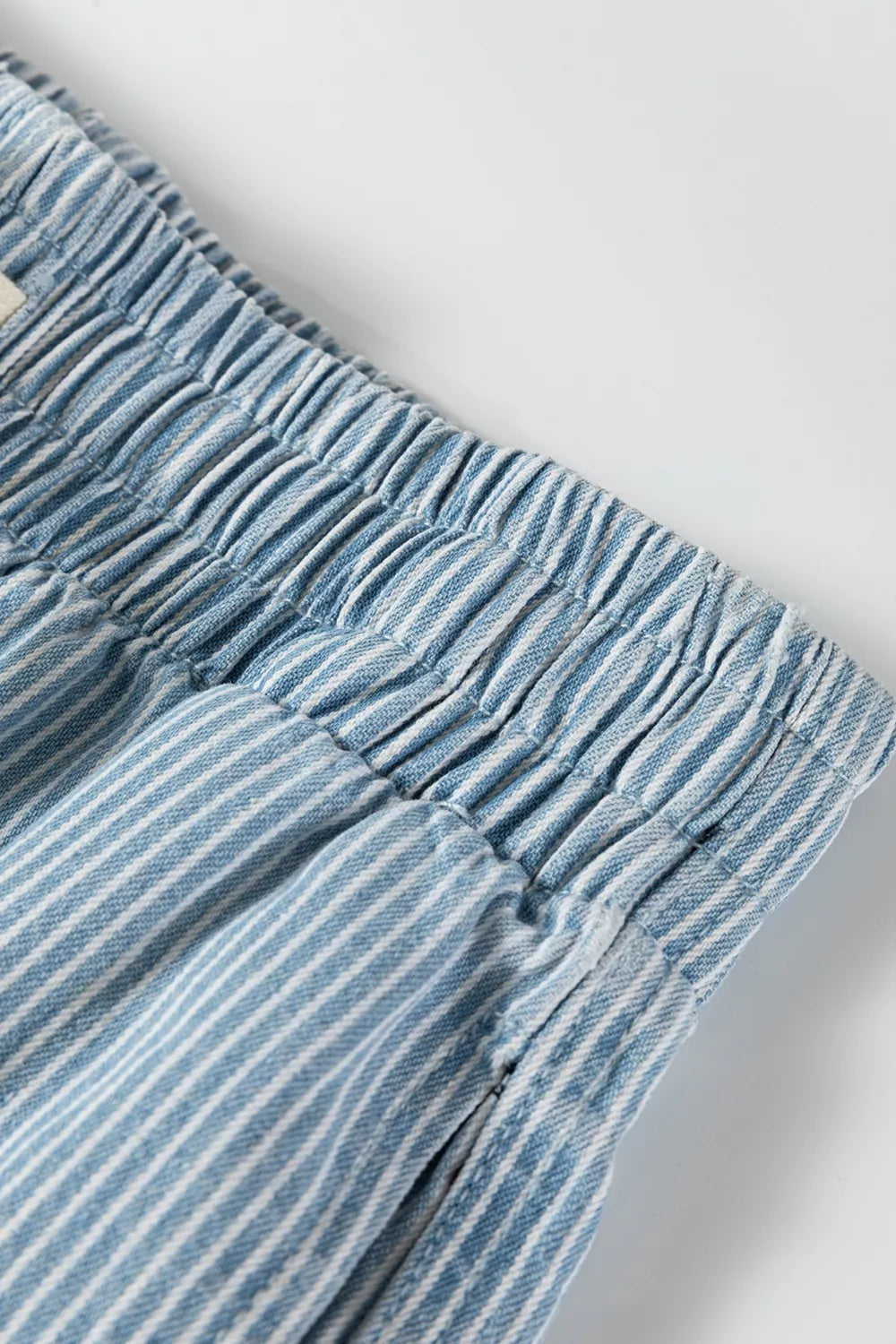 Light blue striped drawstring shorts fabric texture view