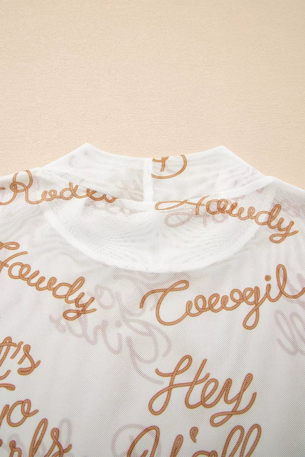 White sheer mesh high neck long sleeve top close up view