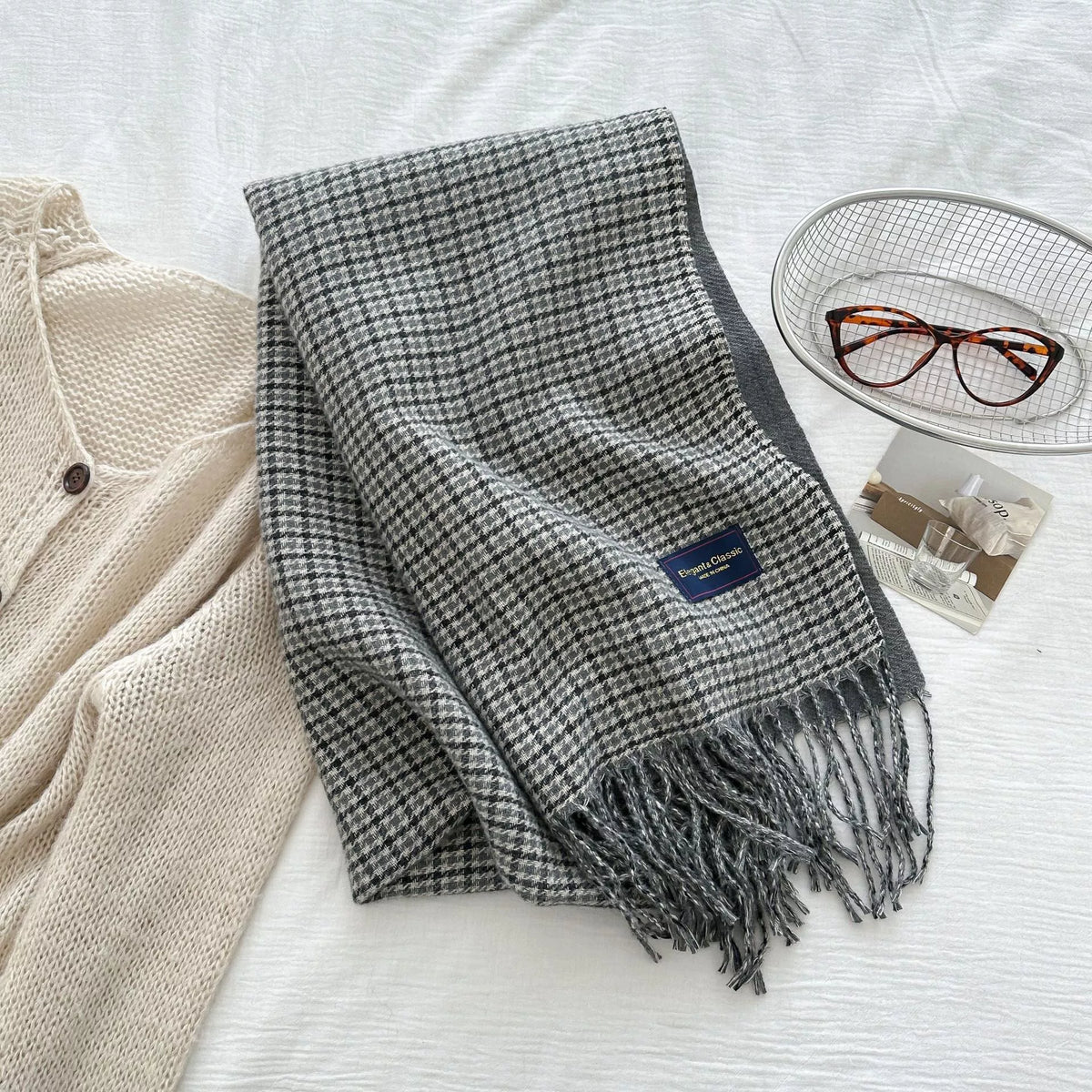 Detail of the soft fringe ends on the plaid scarf