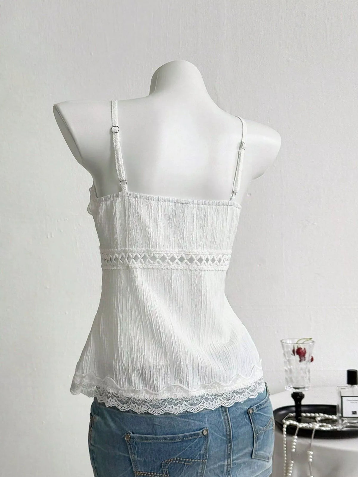Lace trim cami laid flat to show the cut
