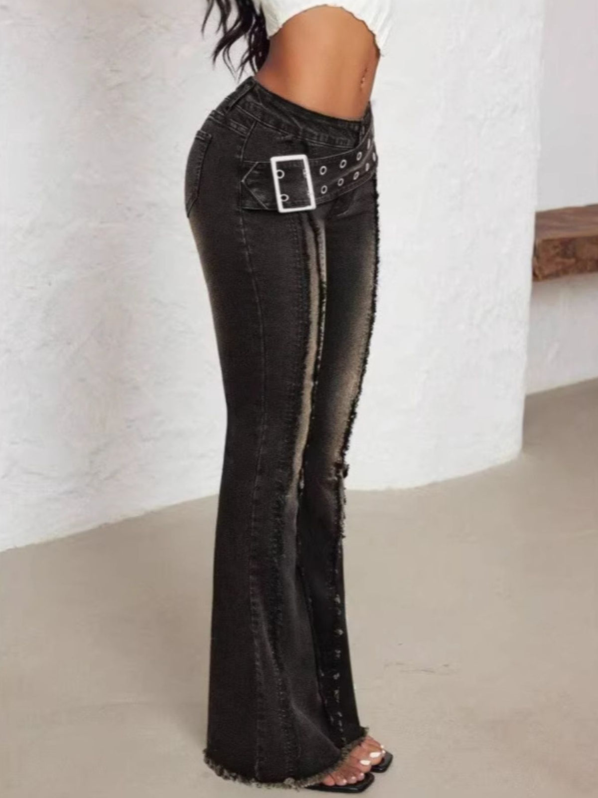 Full length styling of belted flare jeans
