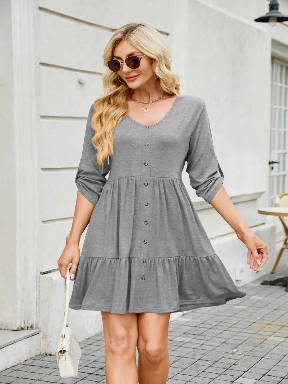 Full look of tiered ruched mini dress