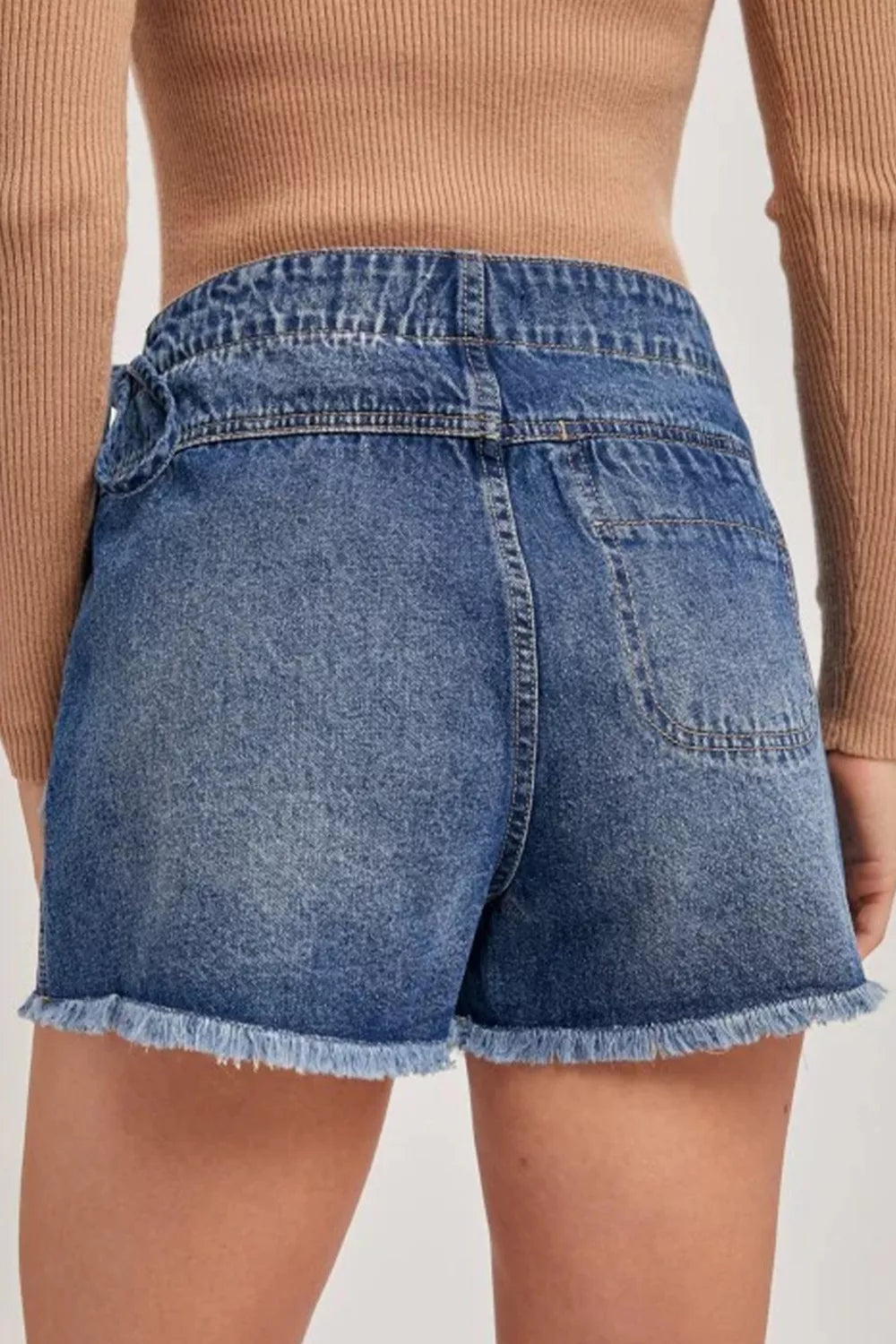 Medium wash wrapped tie waist denim skort side view