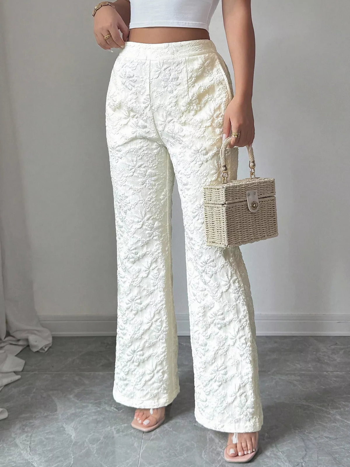 Wide leg pants shown at a side angle showing the long fall
