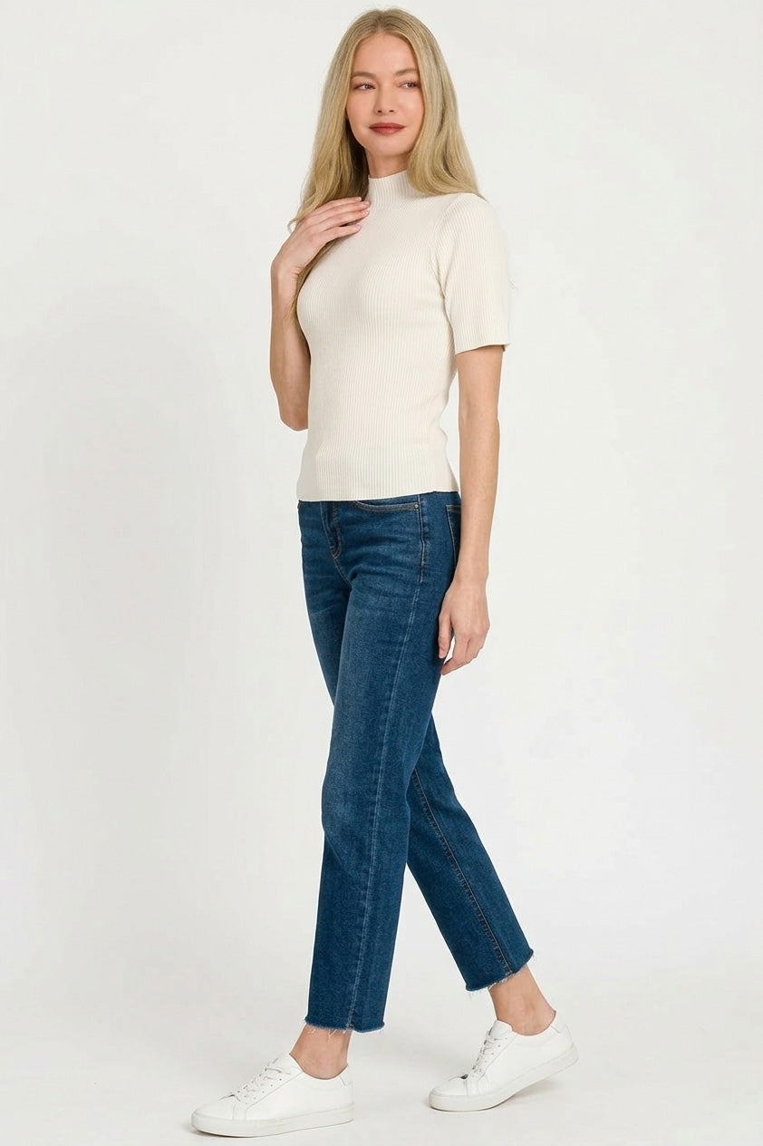 Ribbed ivory sweater fabric texture detail