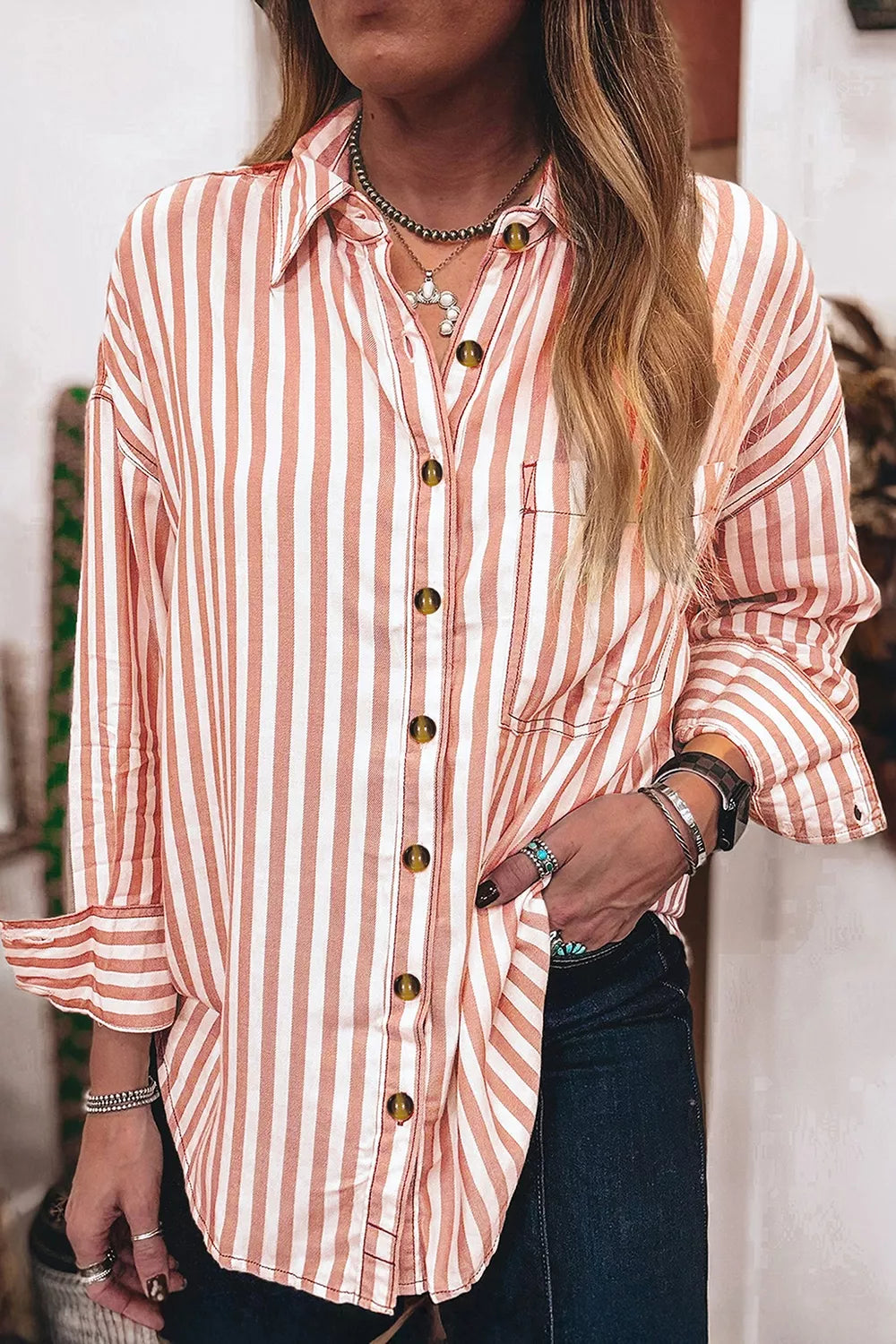 Back view of the dusty pink striped long sleeve shirt