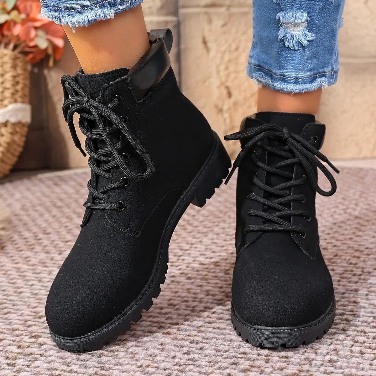 black lace up block heel boots styled on model