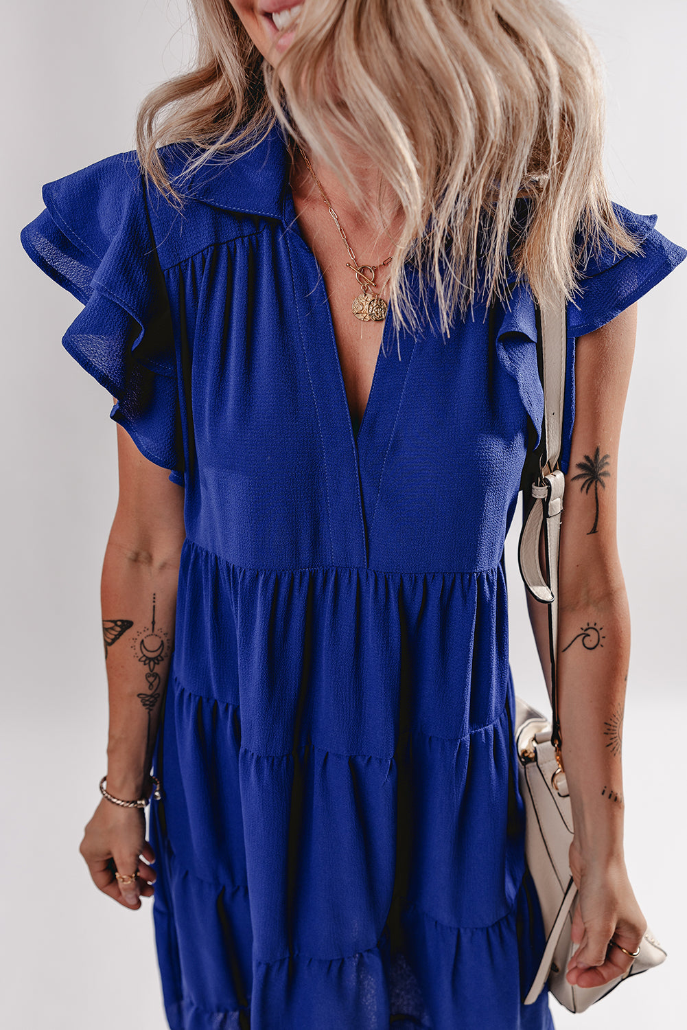 Blue elegant midi dress ruffle sleeve close up