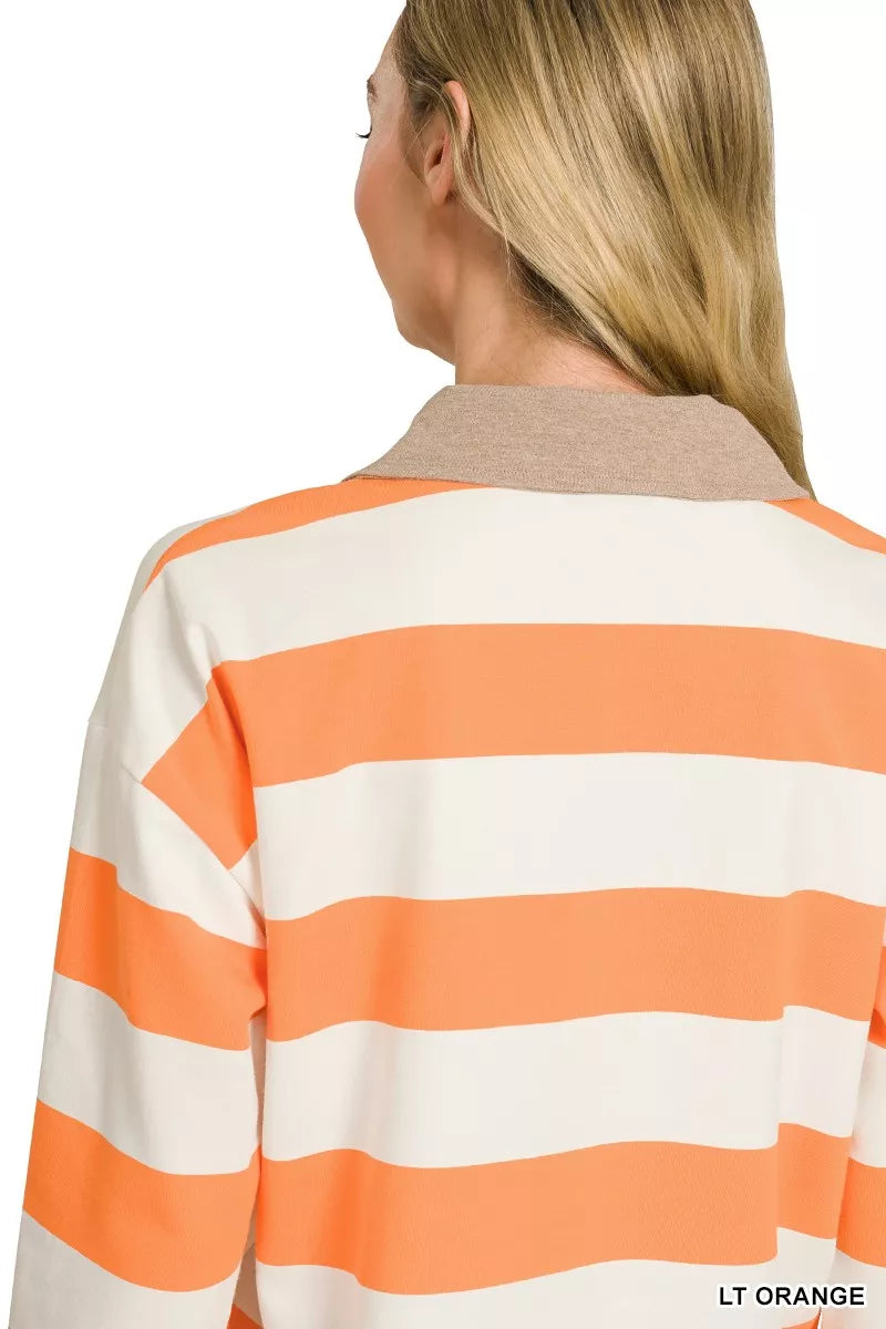 Light orange striped polo top styled on model, side angle