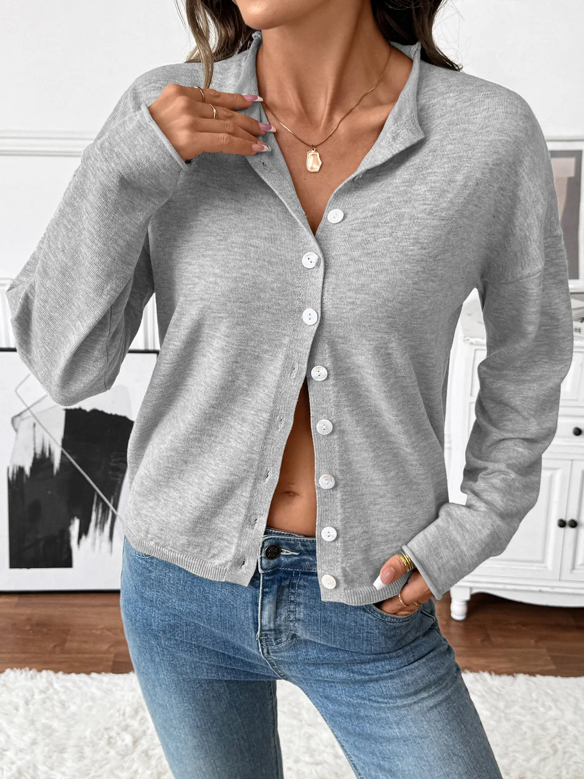Button front cardigan worn open layering