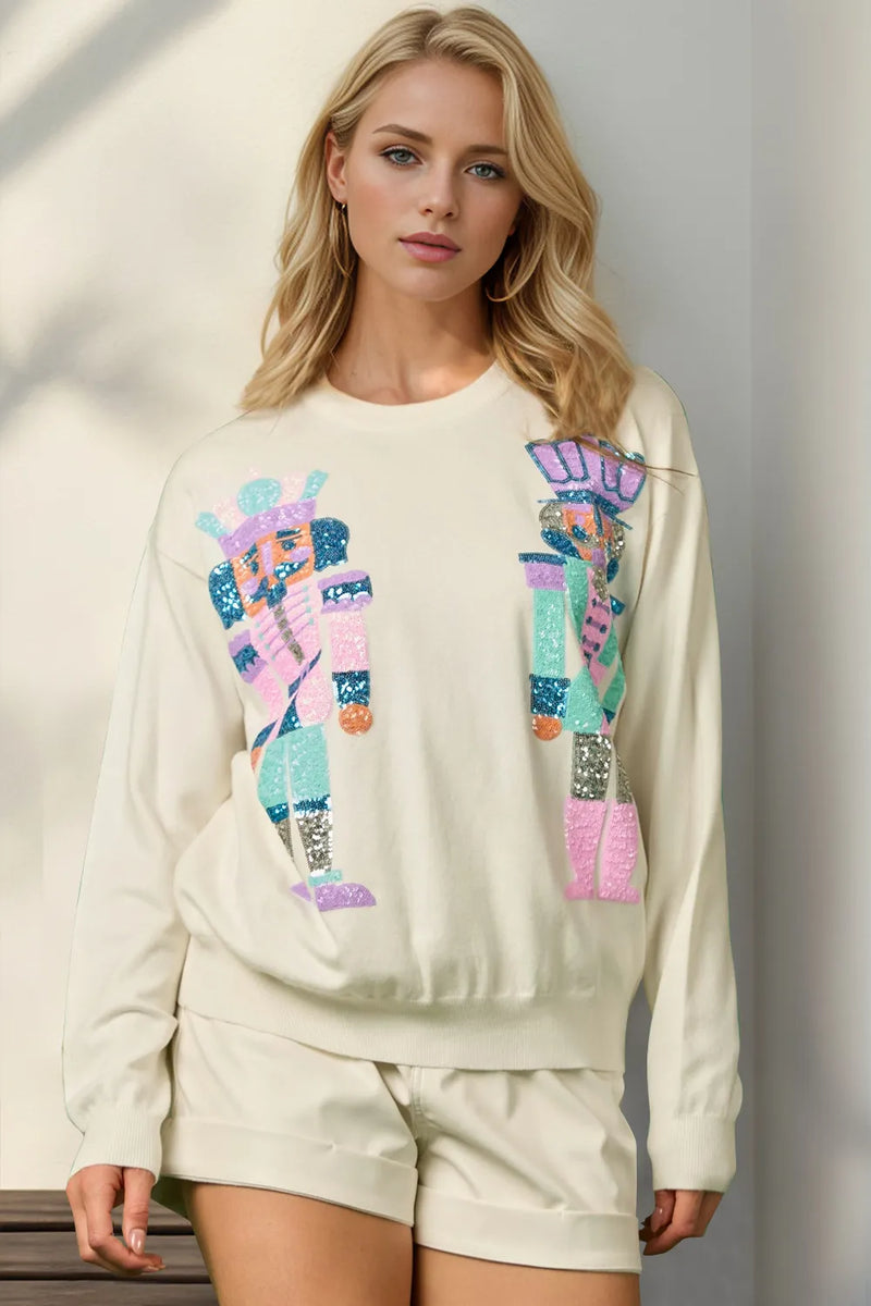 Sequin nutcracker long sleeve sweater in cream front view