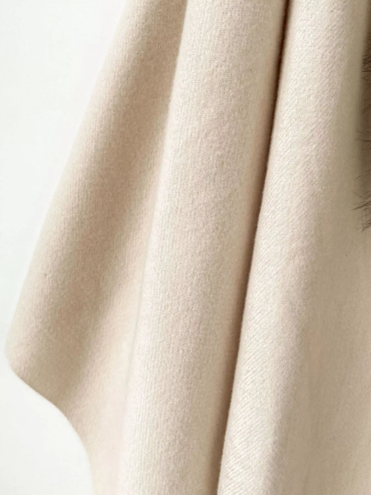 Plush faux fur wrap with elegant fringed ends