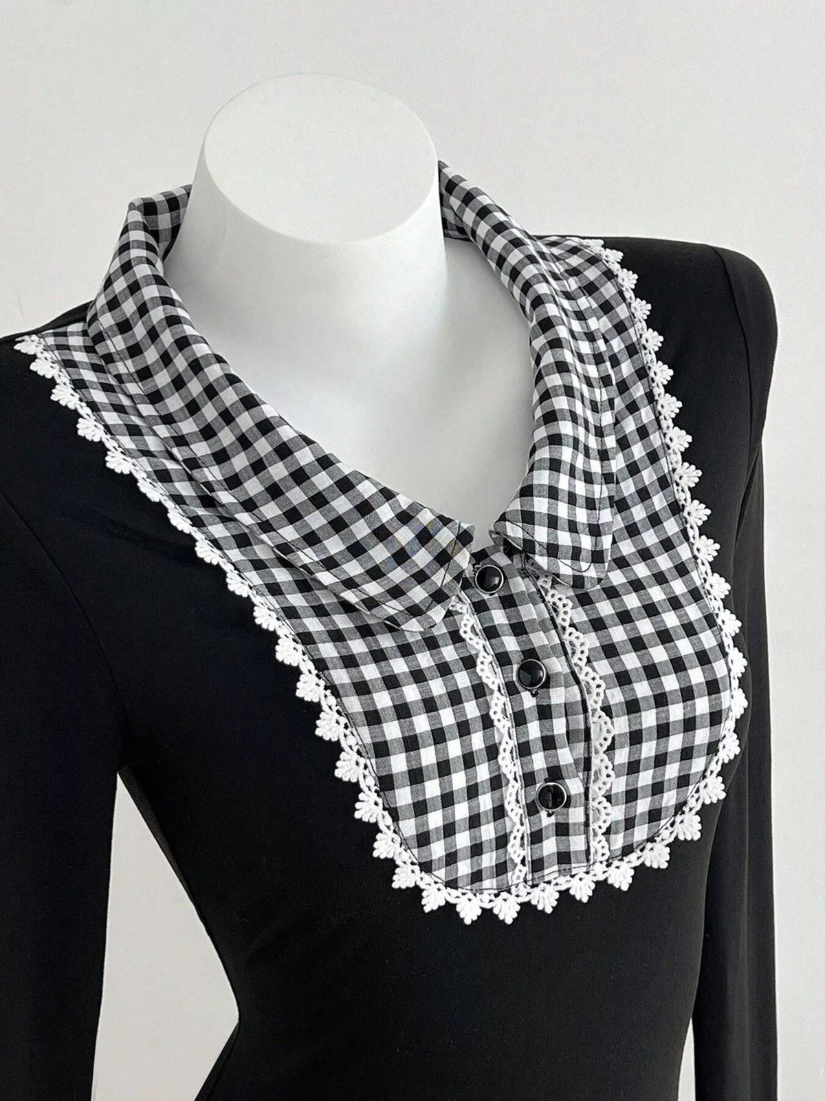 Close up of the gingham collar and button placket