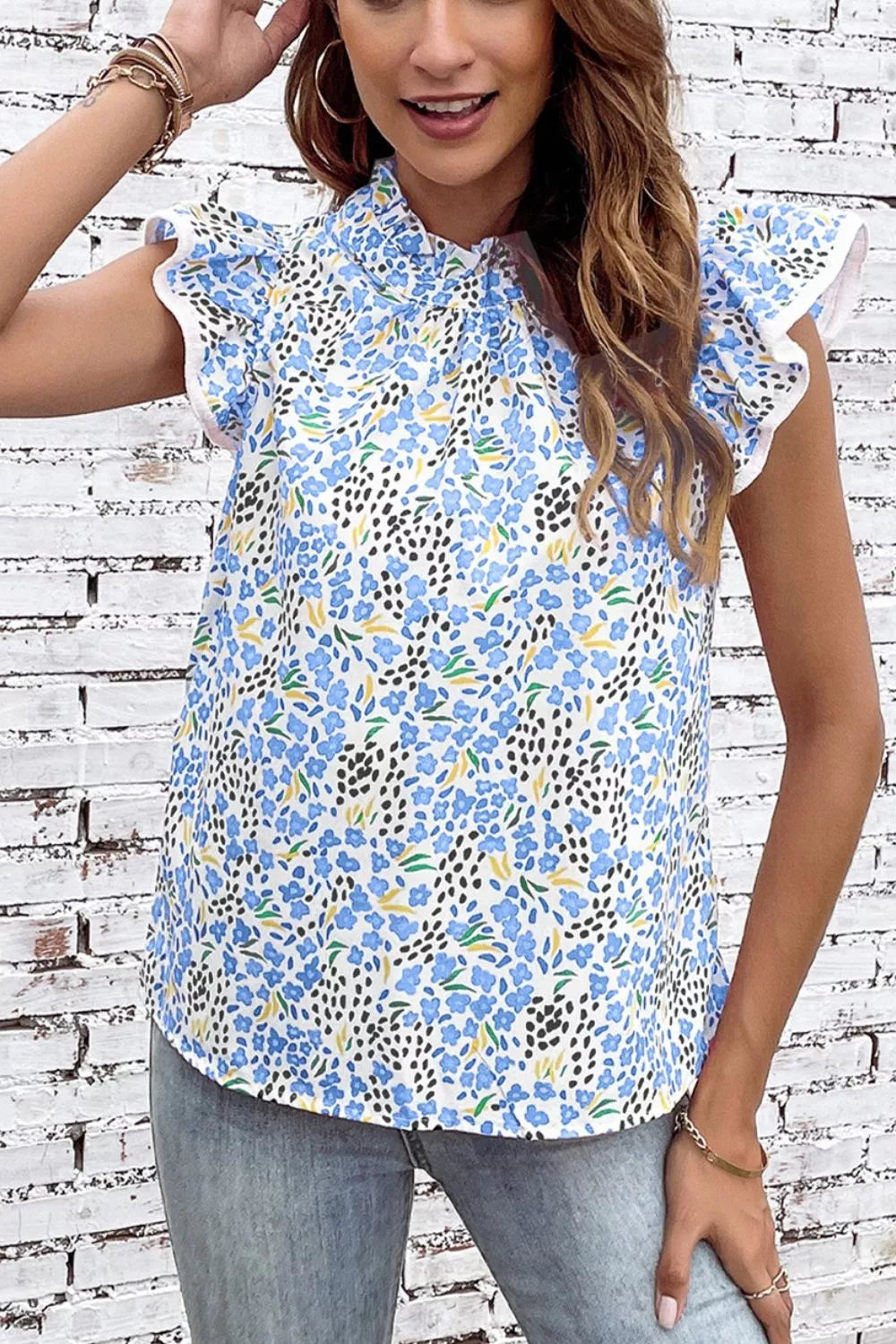 Light blue abstract print flutter sleeve top, back view