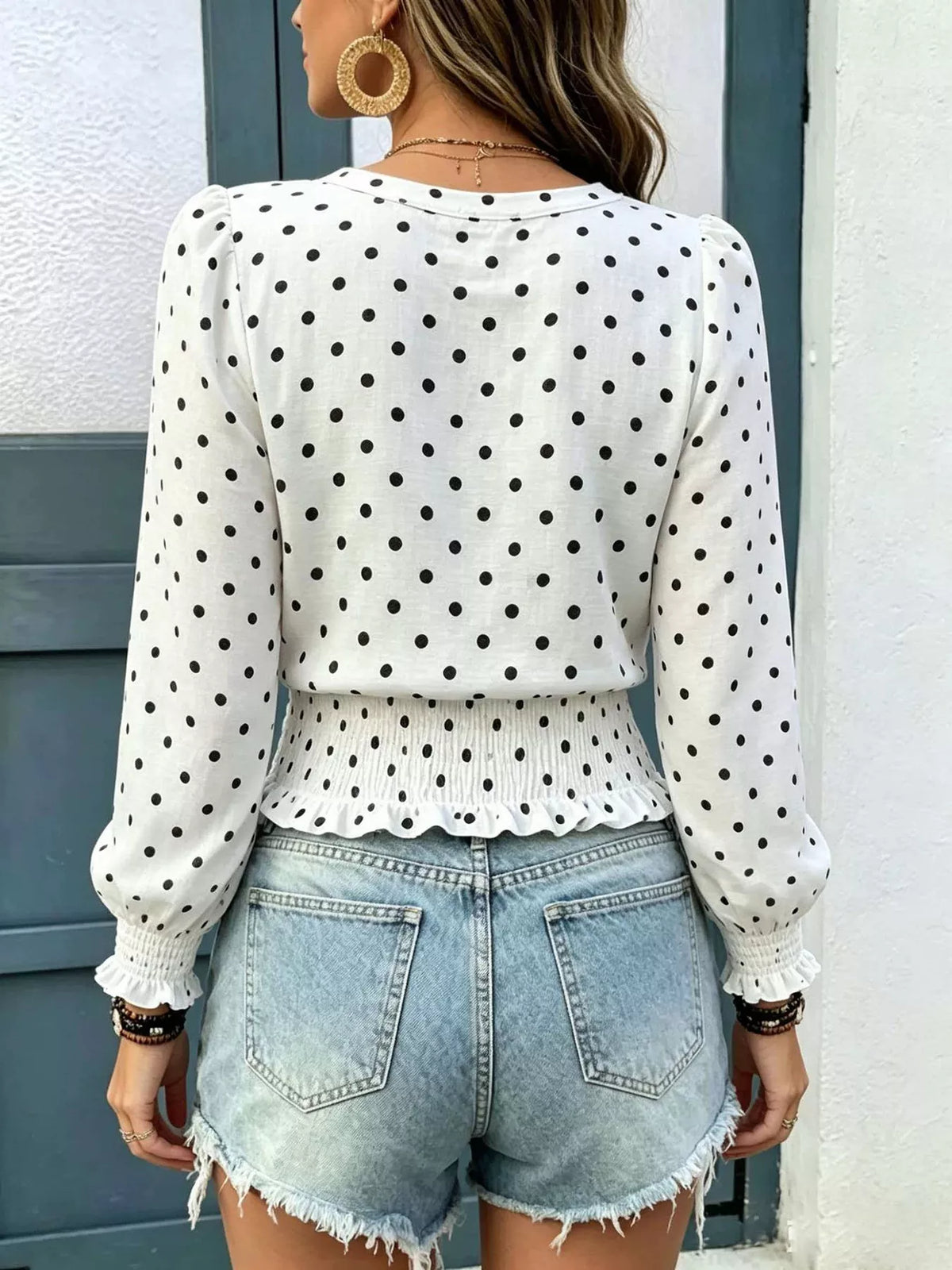 Polka dot blouse shown from the side