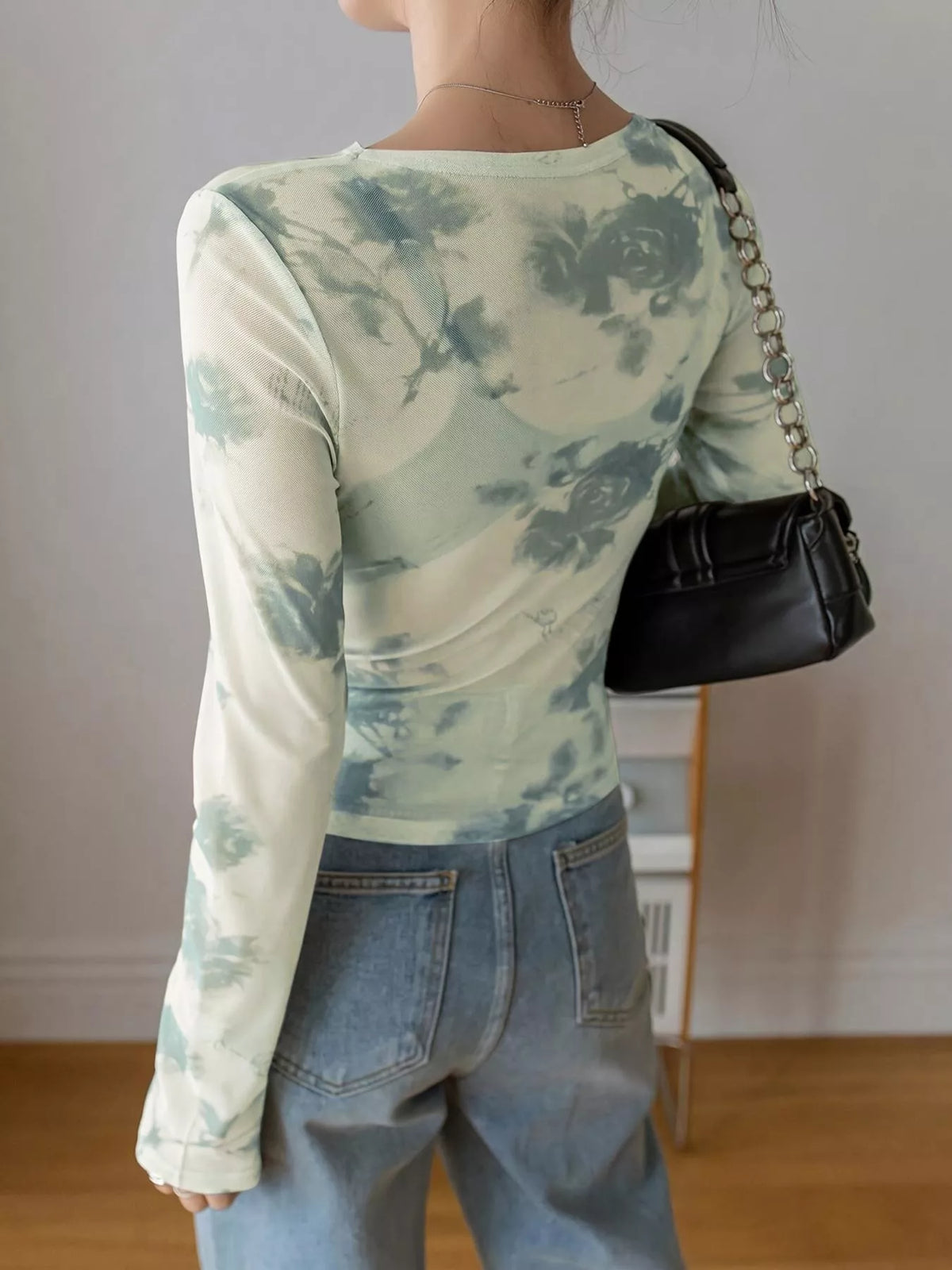 Green floral sheer mesh long sleeve tee on model