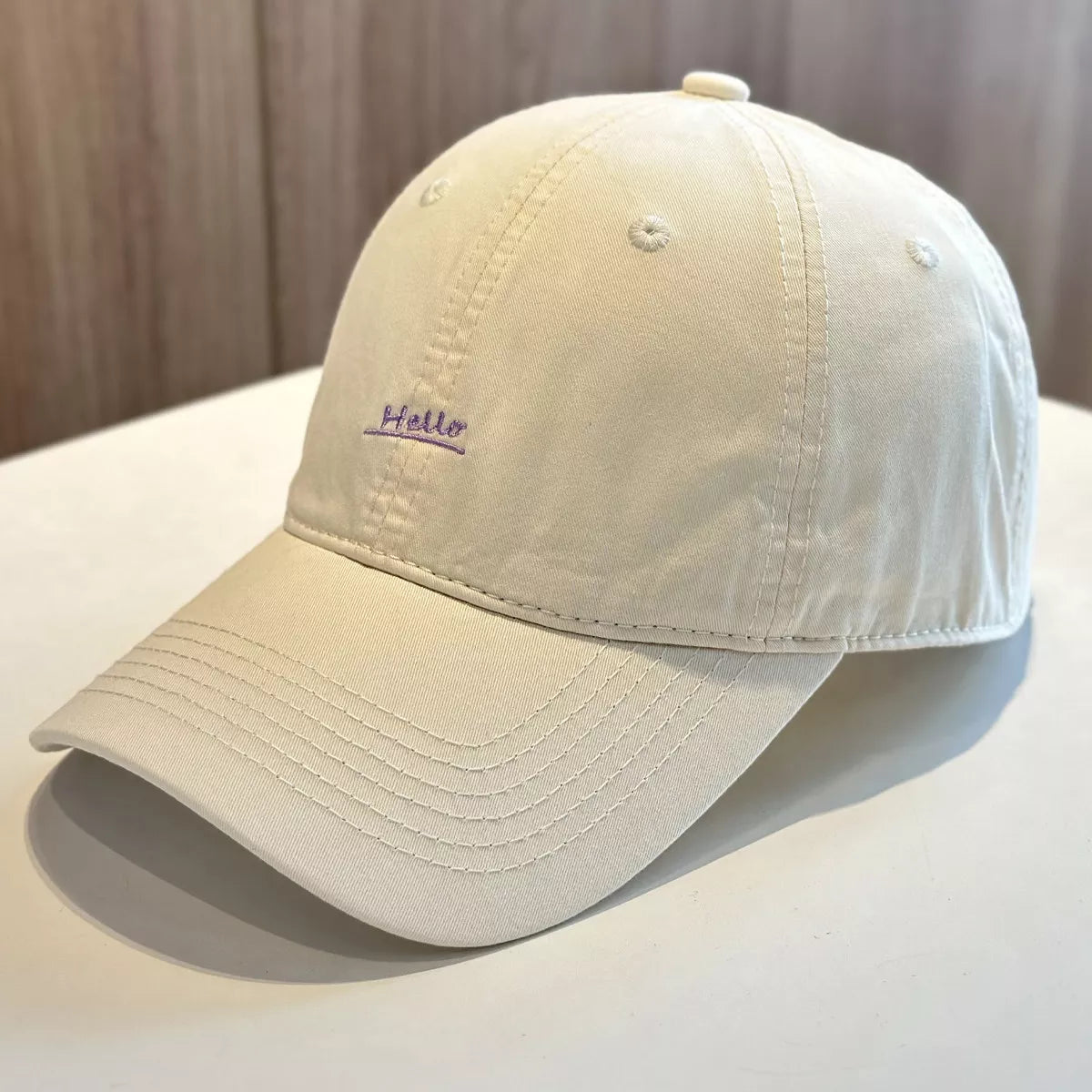 Baseball cap shown from the side with curved brim