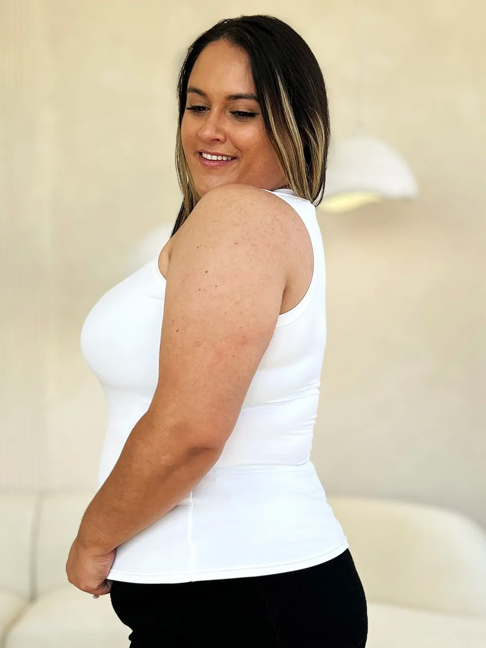 Slim fit sleeveless tank shown from the side