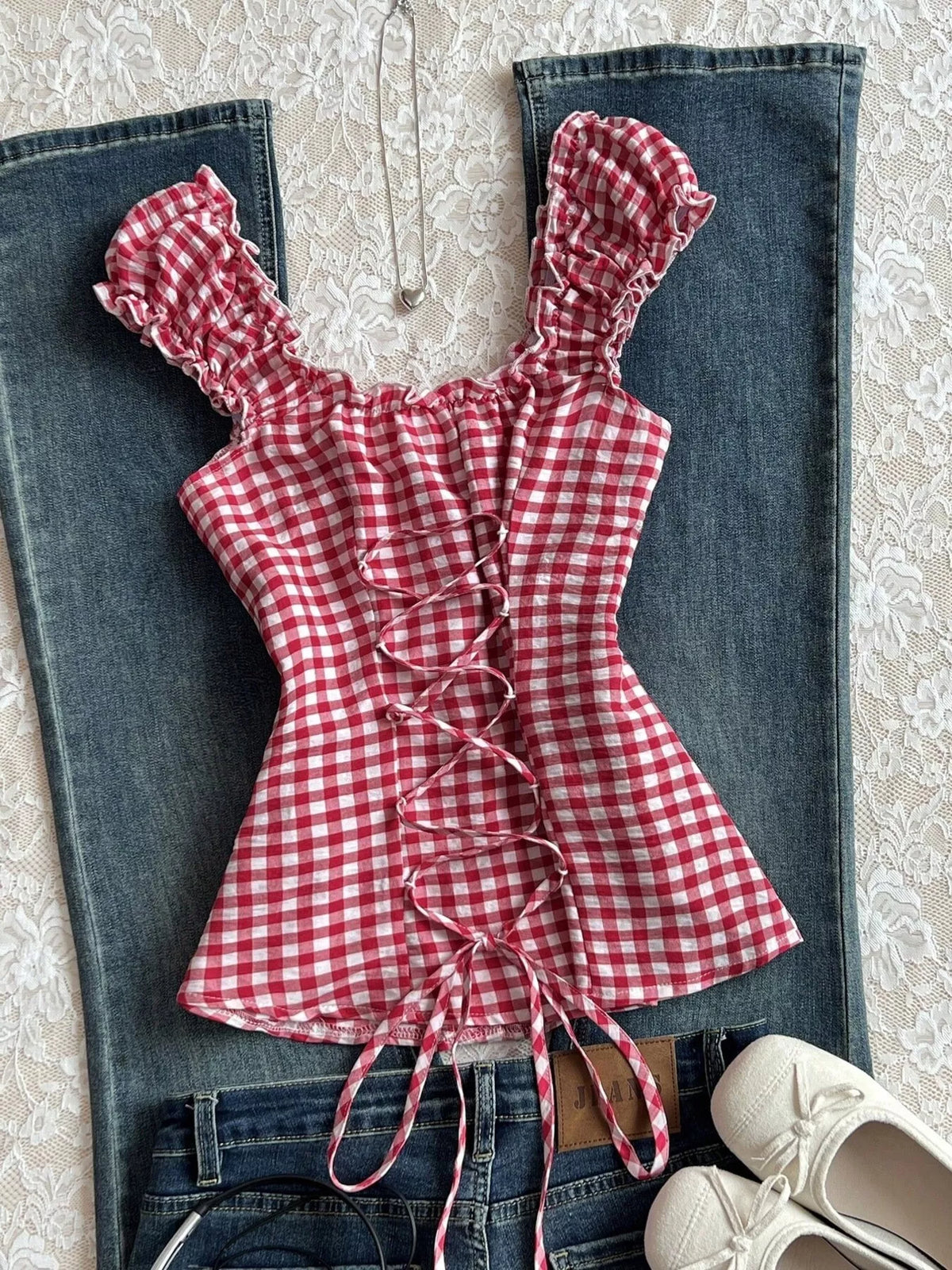 Gingham blouse styled with denim shorts