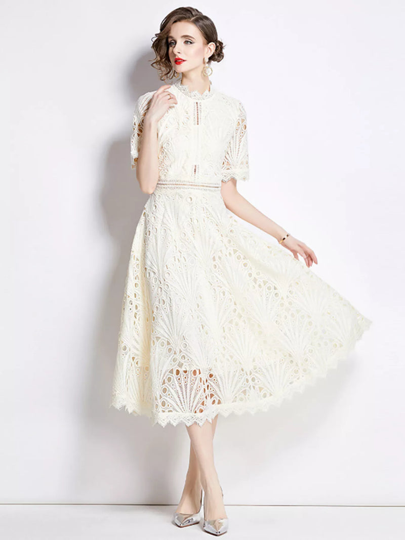Woman wearing light apricot lace short sleeve midi dress front view