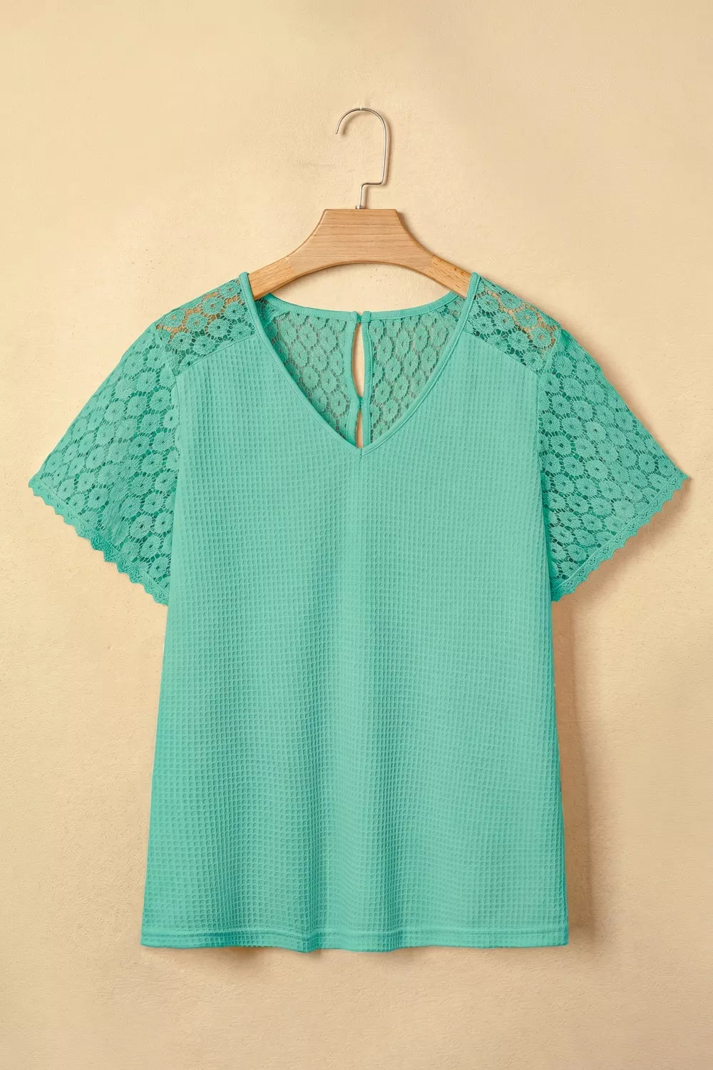 Turquoise waffle knit v neck top with lace trim front view
