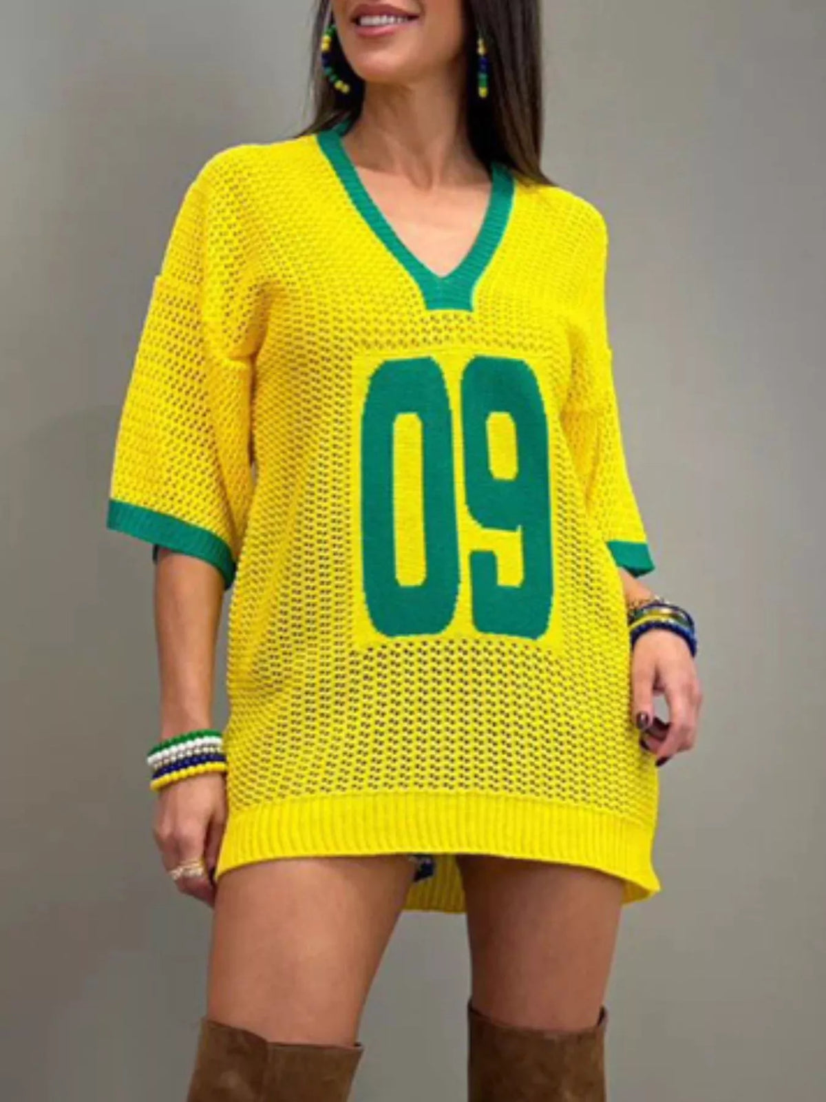 Yellow openwork knit oversized sweater side view