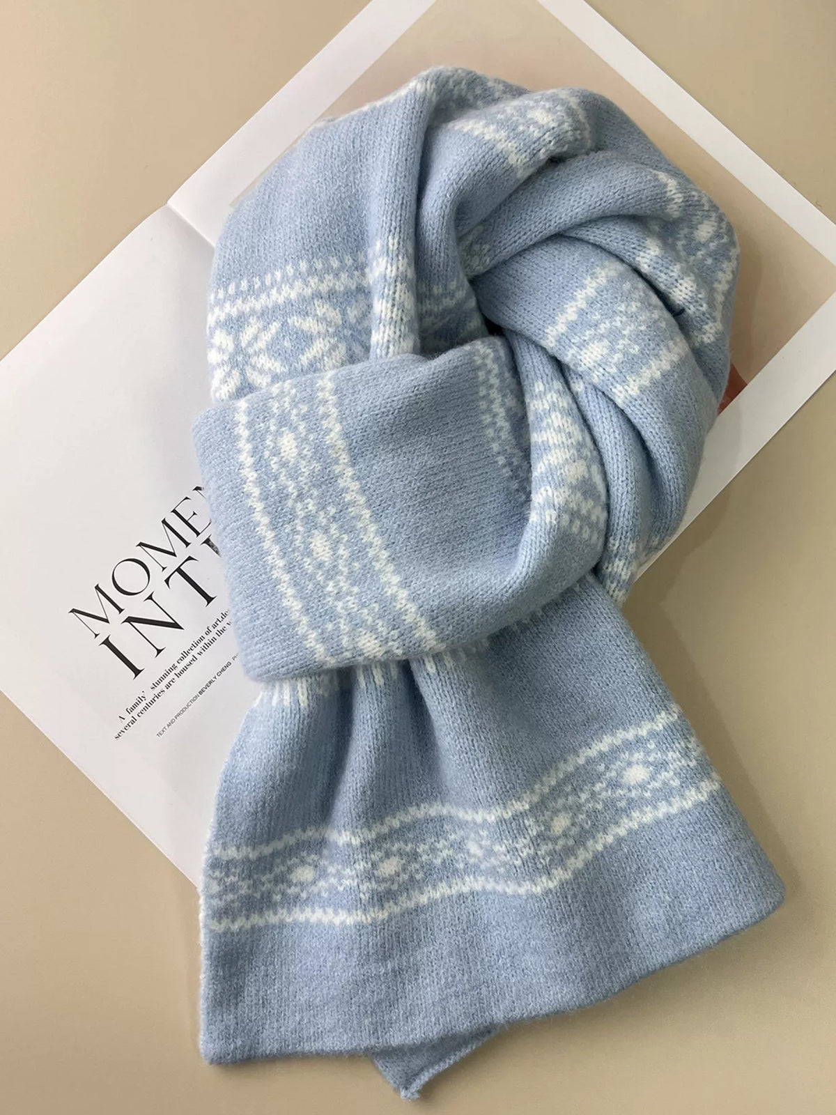 Snowflake scarf styled over a winter coat