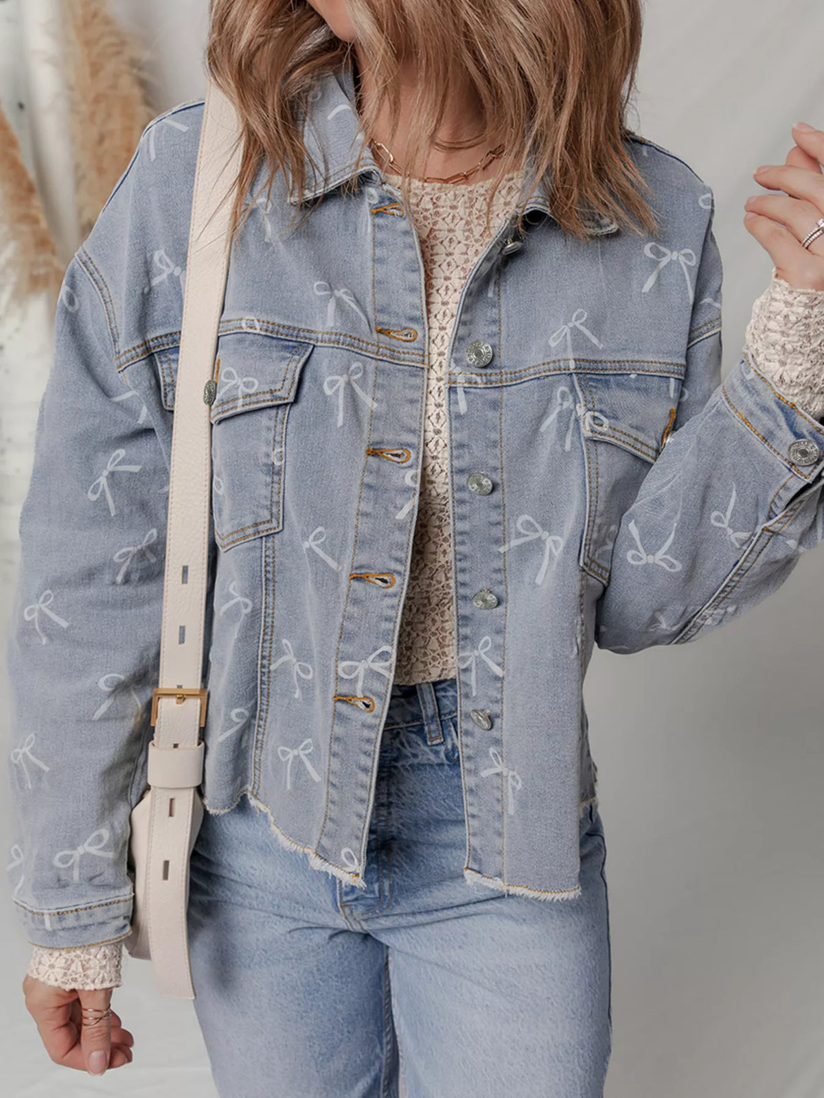Bow Print Raw Hem Denim Jacket in Light Wash detail