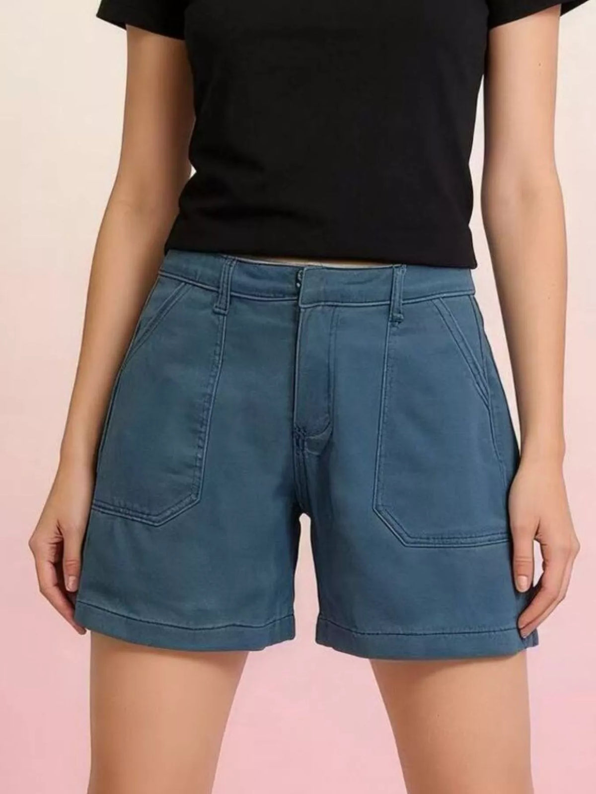 Denim shorts worn with a tucked tank