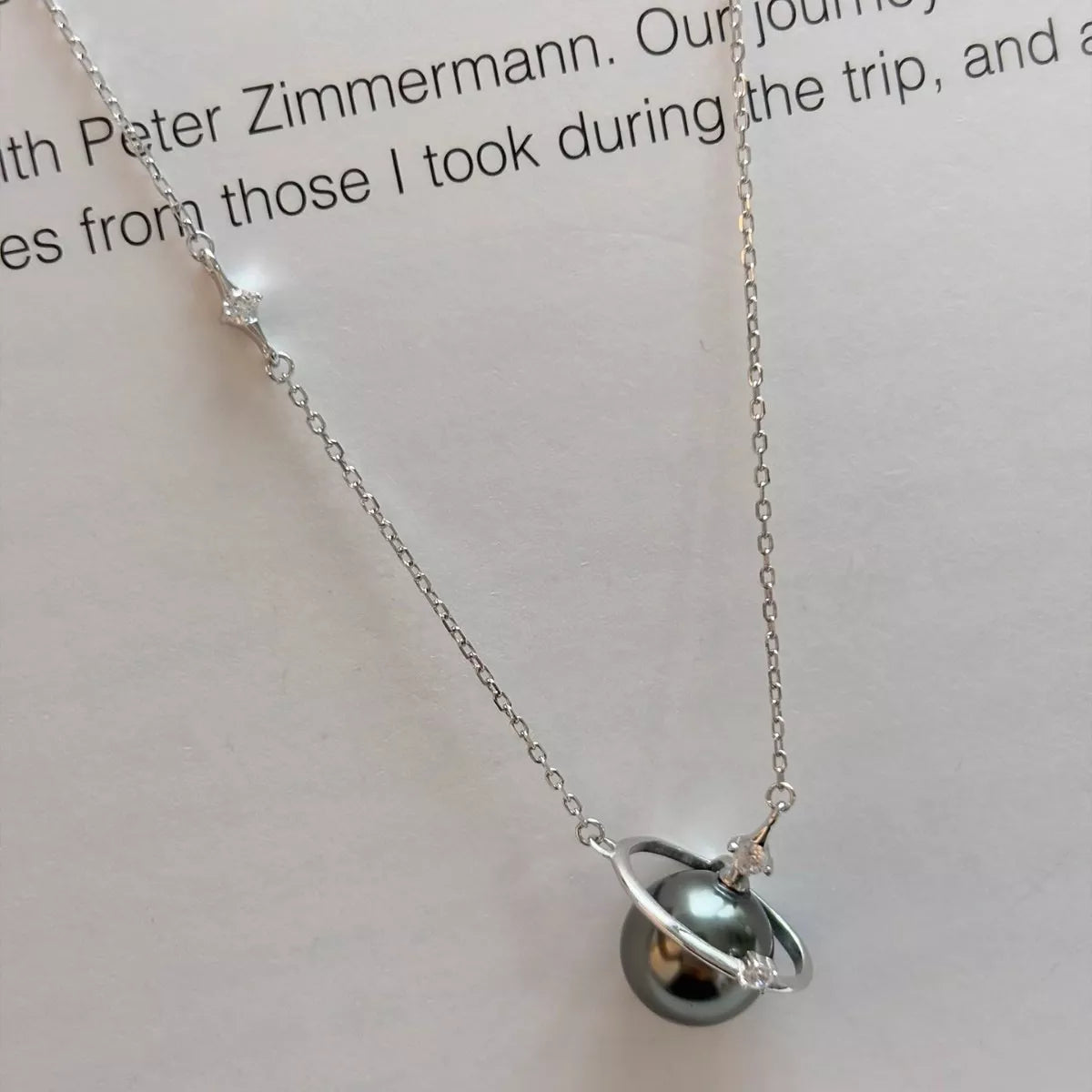 Planet pearl pendant necklace on sterling silver chain front view