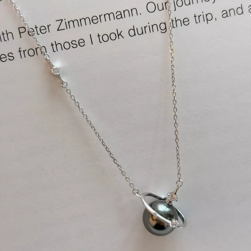 Planet pearl pendant necklace on sterling silver chain front view
