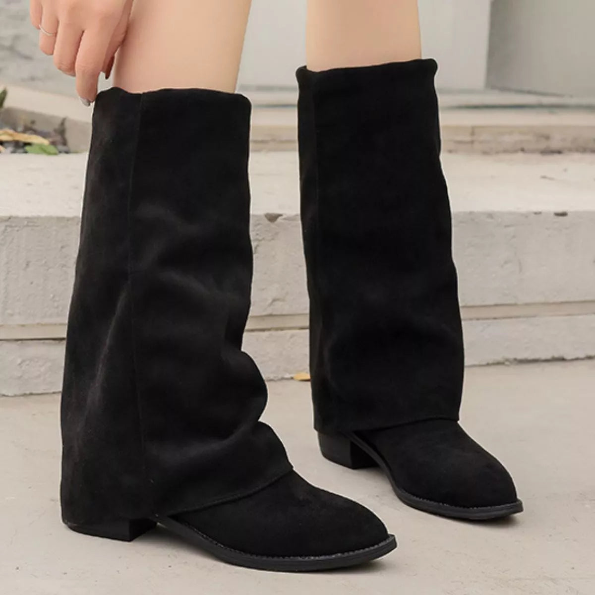 Point toe suede block heel boots angled three quarter view