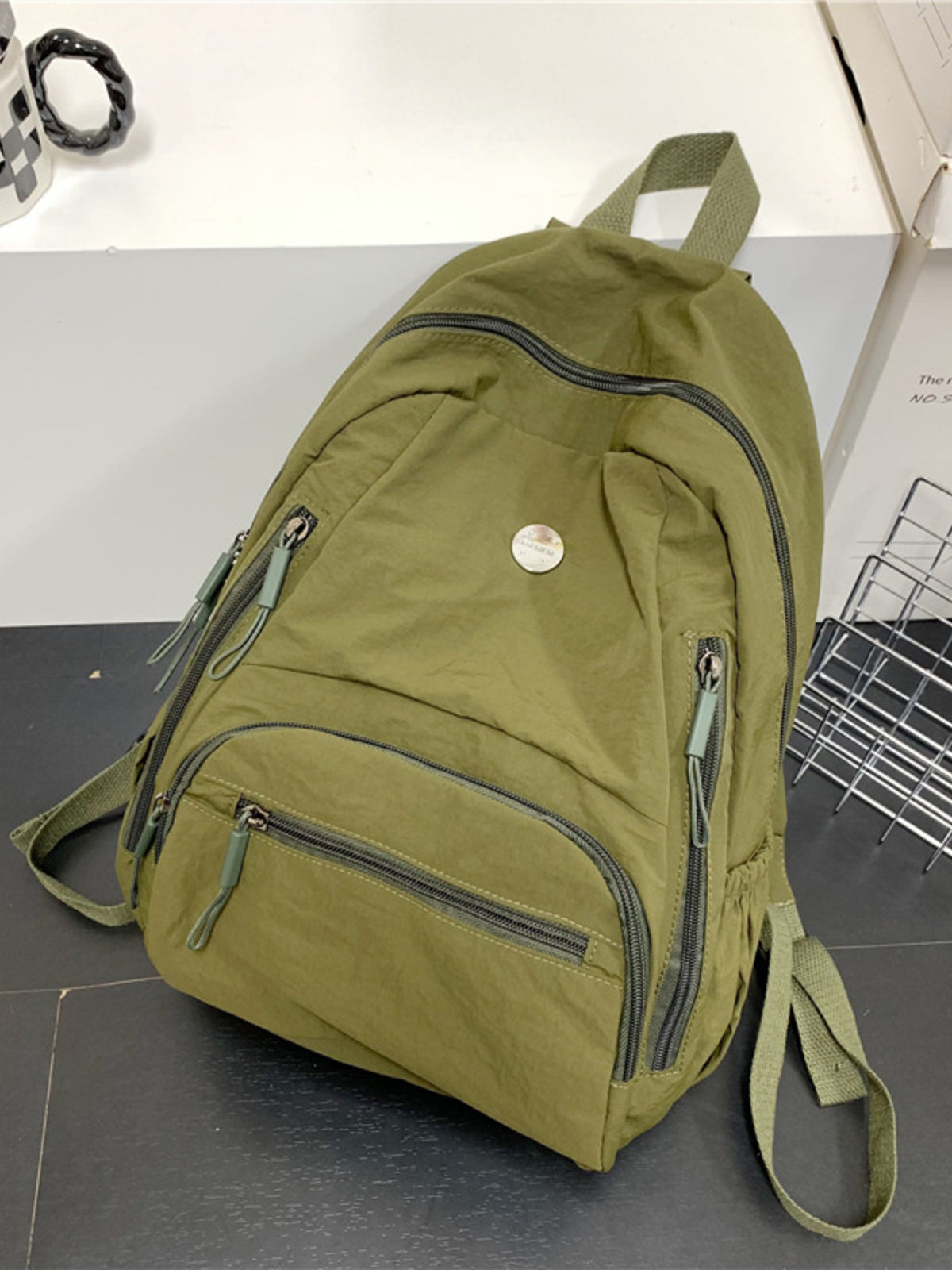 Army green lightweight nylon backpack side profile