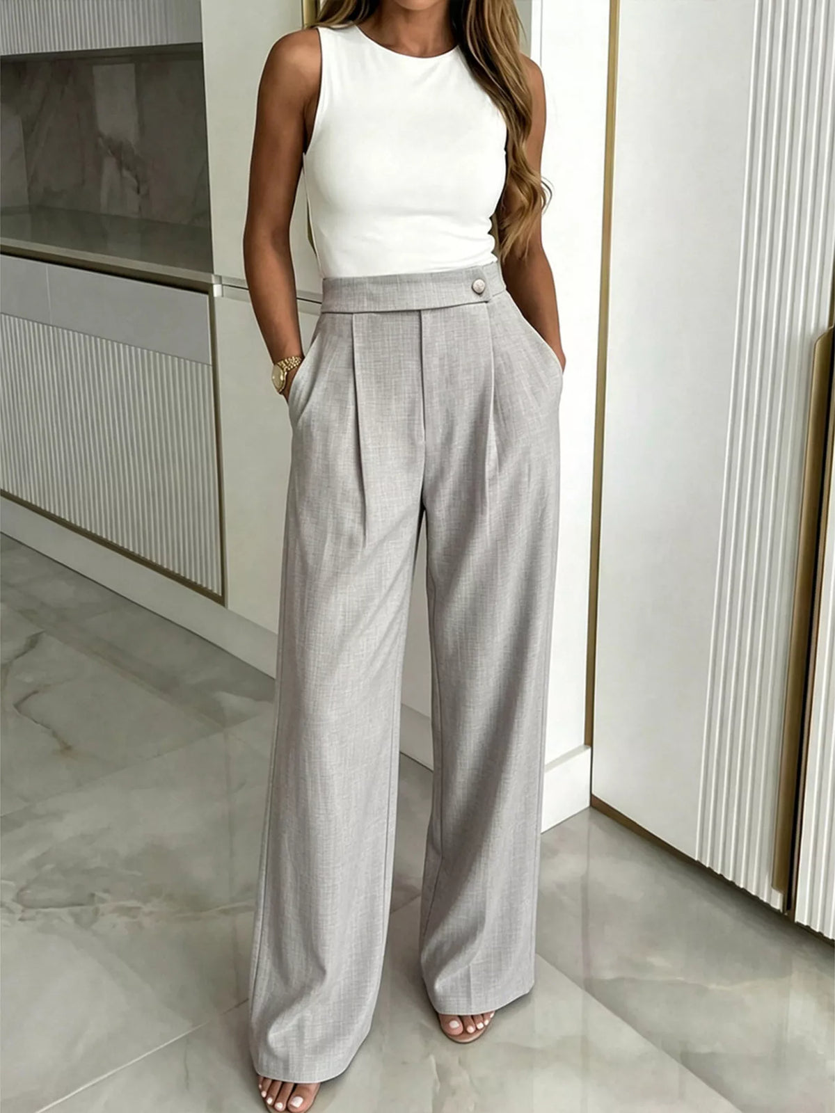 Wide leg pleated trousers side view showing the full leg