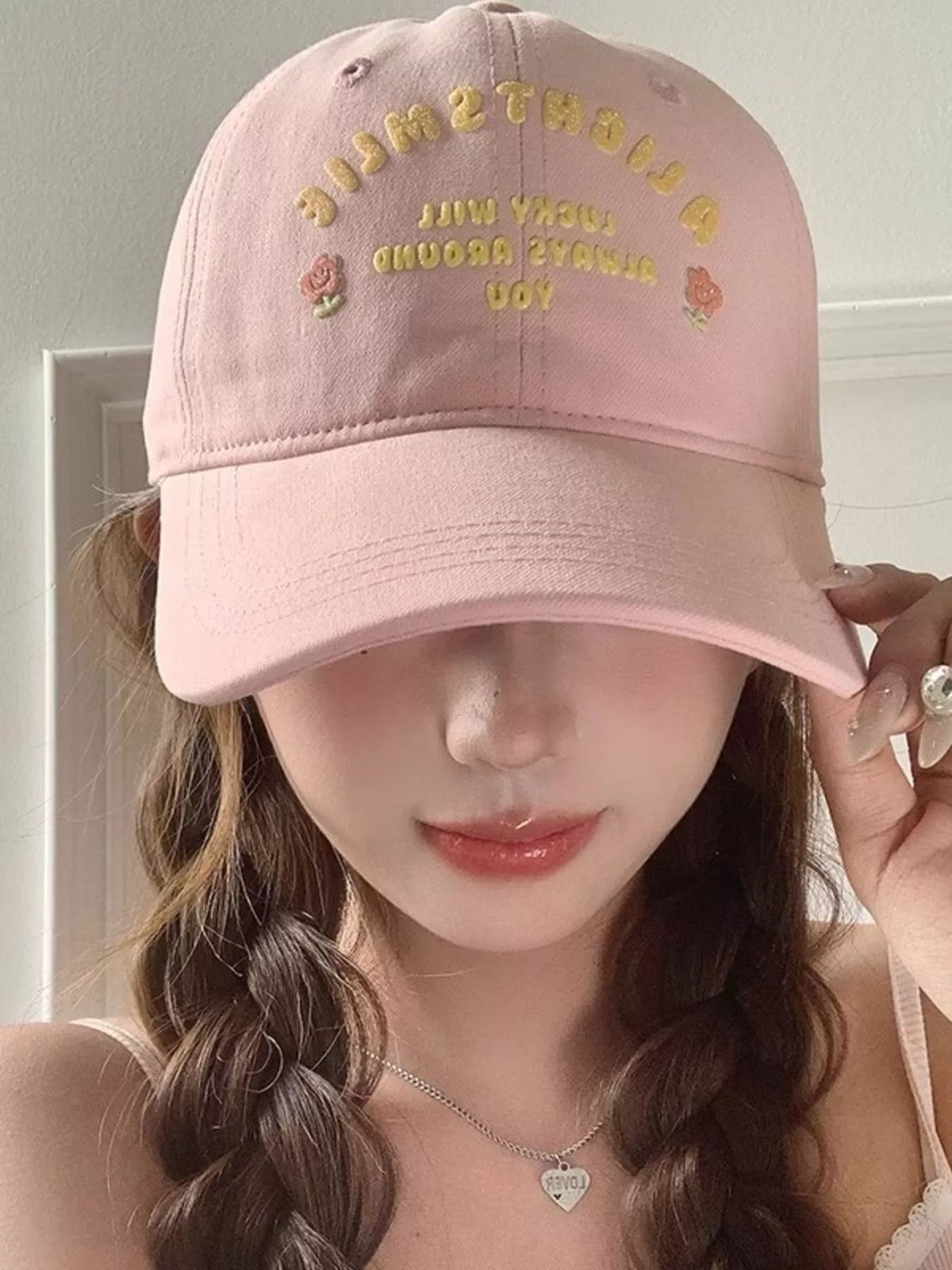 Embroidered baseball cap in a darker colorway, angled view