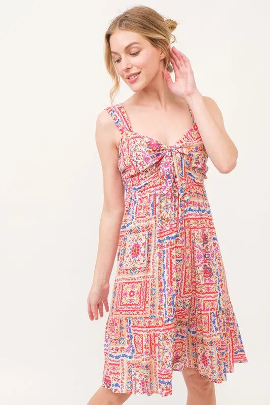 Tie Front Smocked Tiered Boho Dress in Red on model