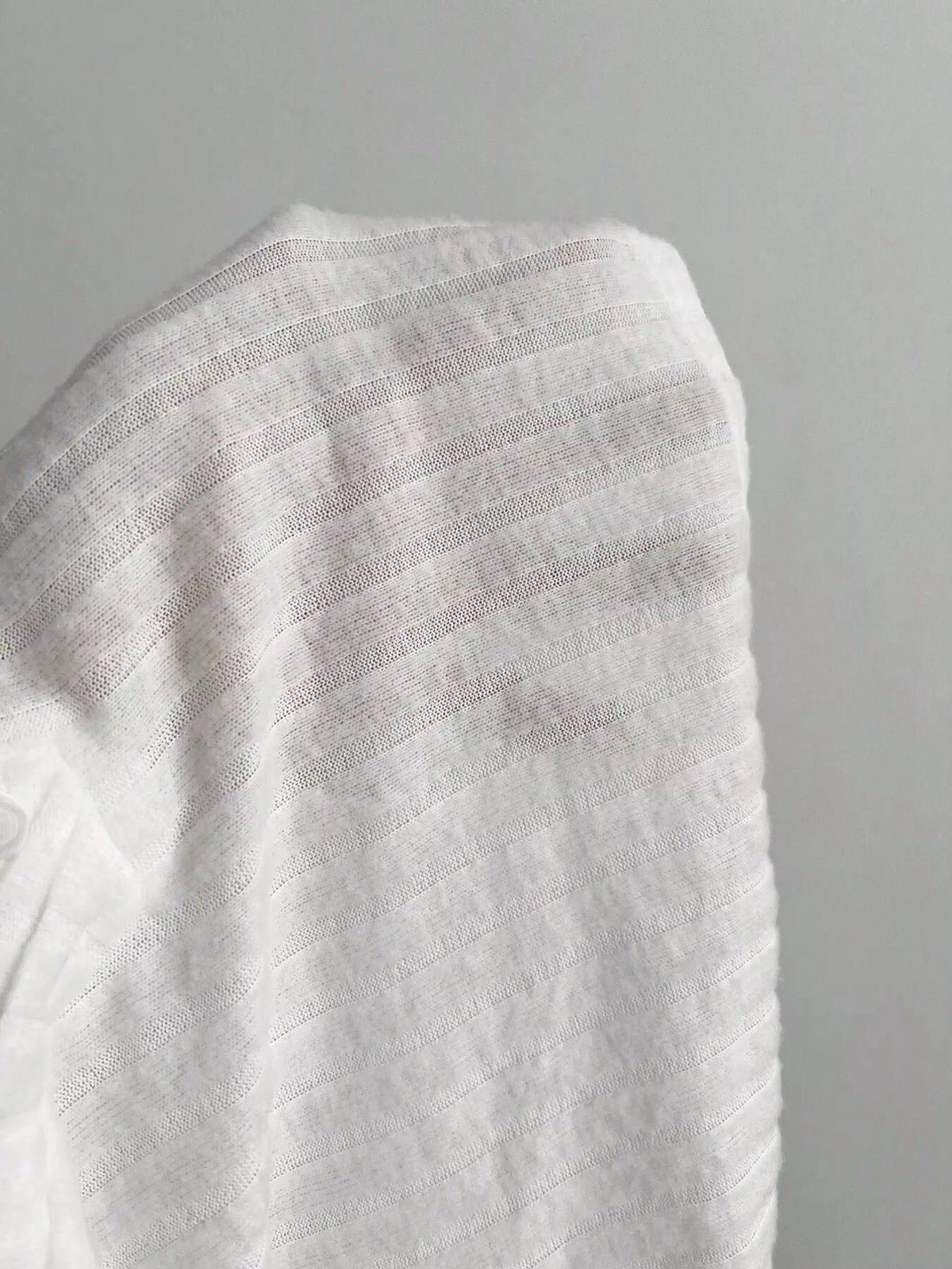 Long sleeve cuff detail on the ribbed knit top