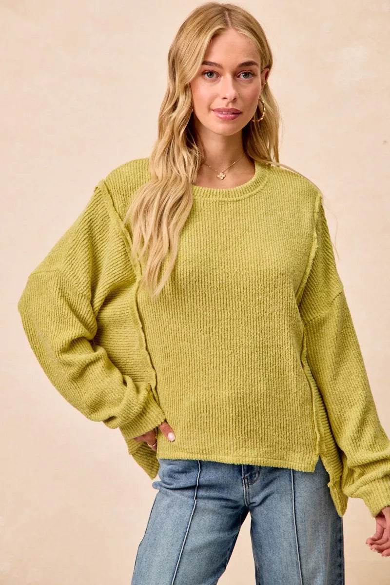 Rib knit uneven hem sweater on model