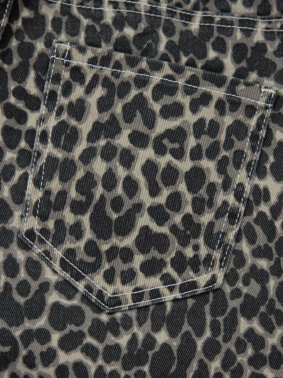 Pocket detail on leopard print jeans