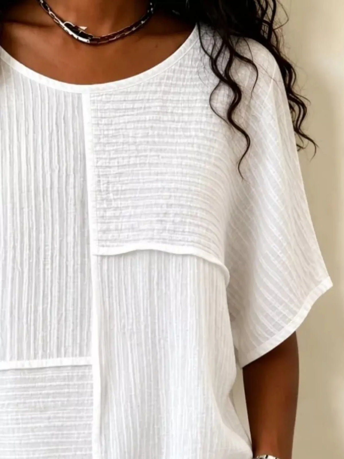 Round neck blouse showing woven texture detail