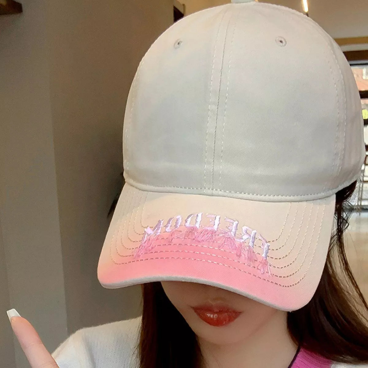 Close up of gradient embroidery detail on cap
