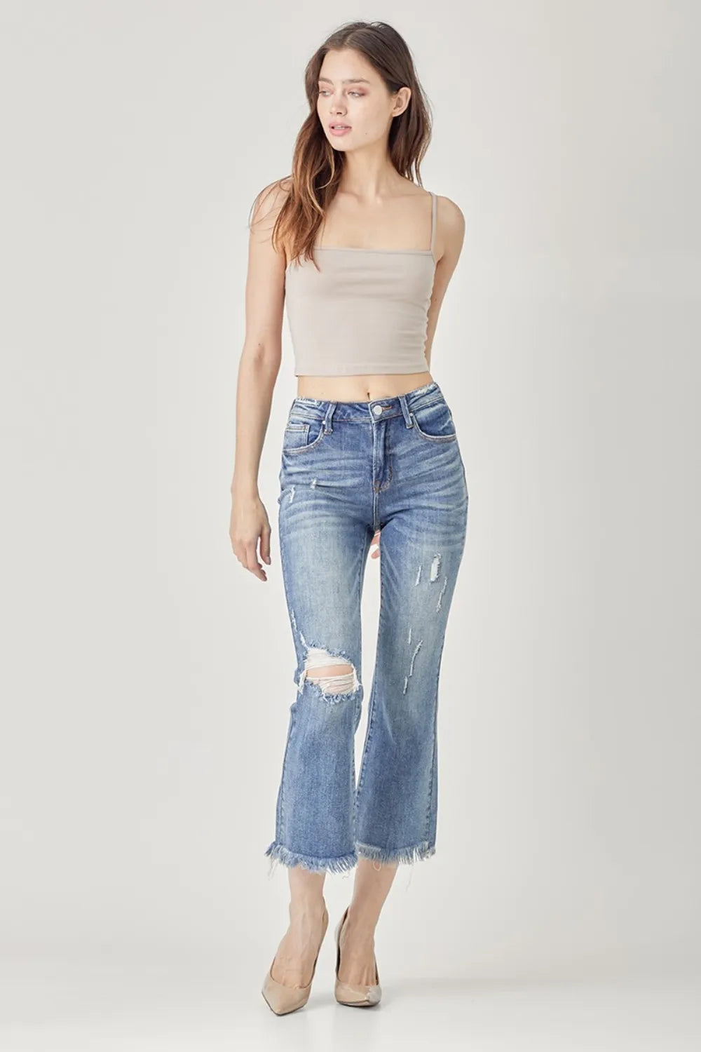 Model wearing RISEN cropped bootcut jeans styled outfit