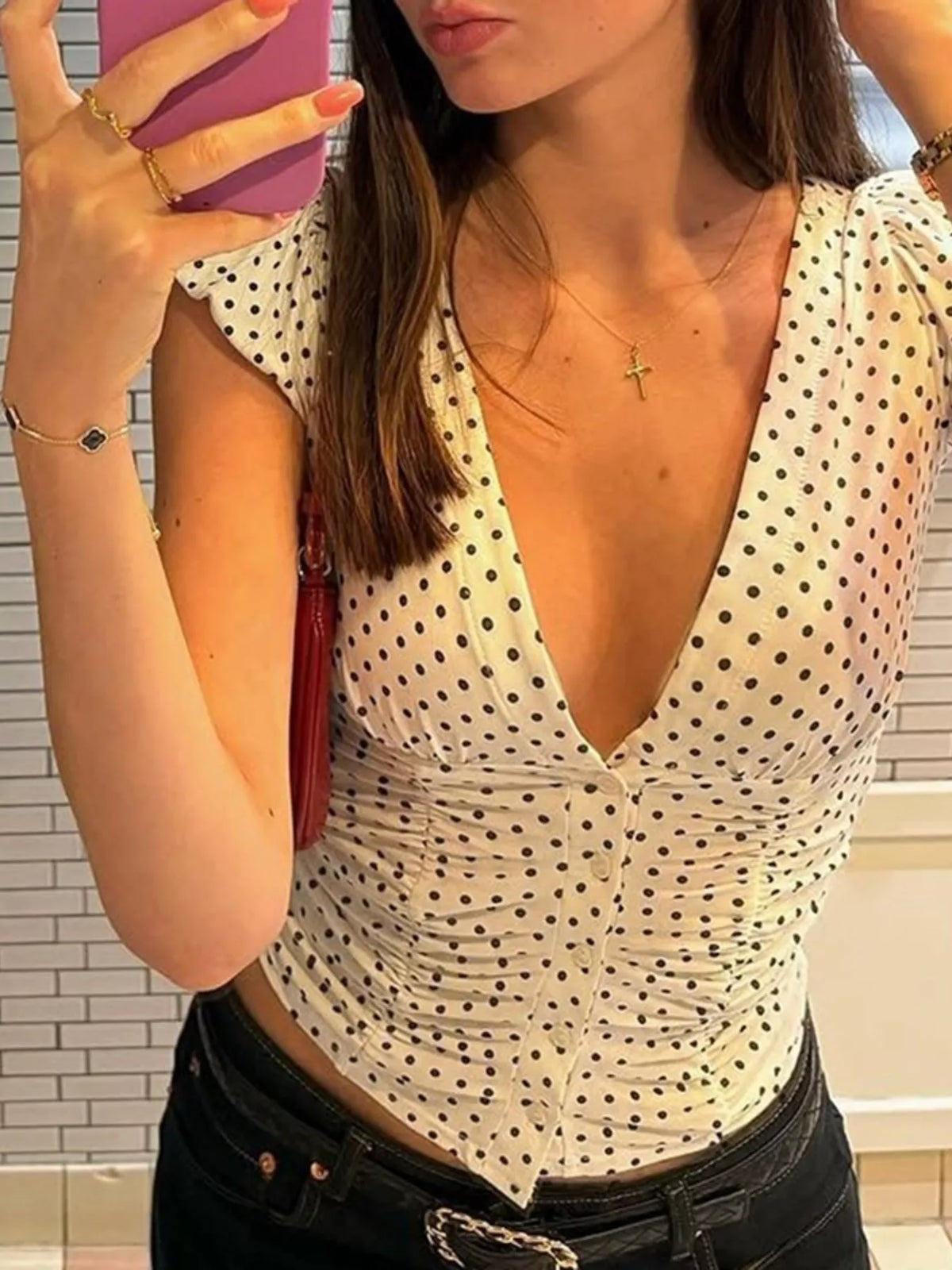Hem detail on the white polka dot top