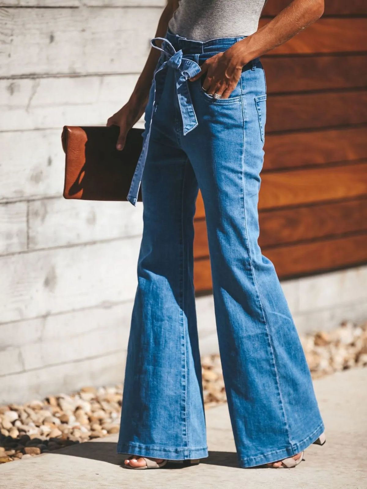 Tie front flare jeans on model showing bow waist