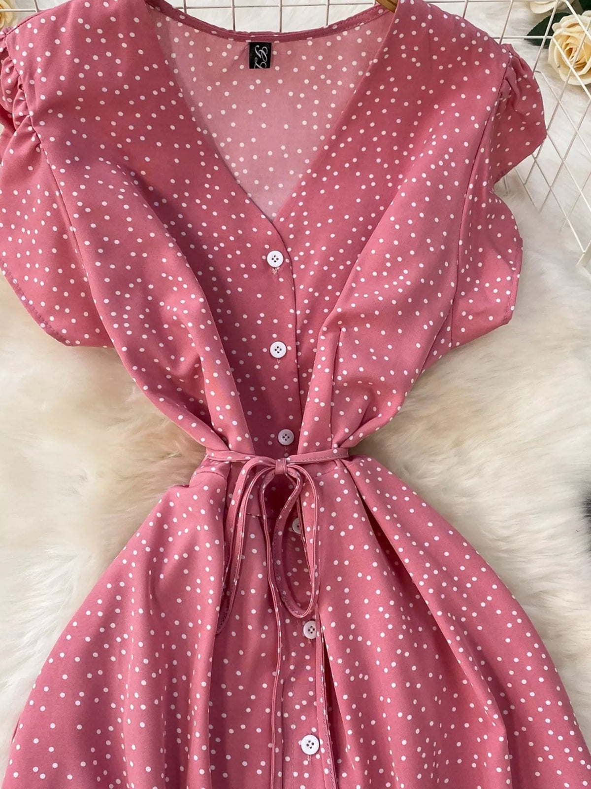 Pink polka dot button up belted maxi dress front view