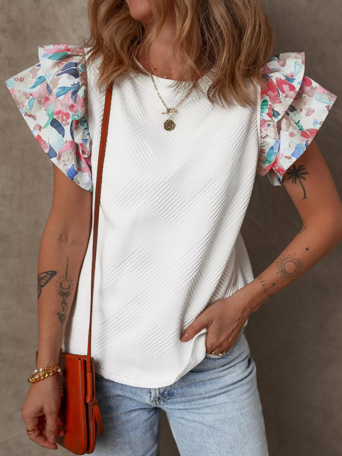 White abstract print tiered ruffle sleeve top side view