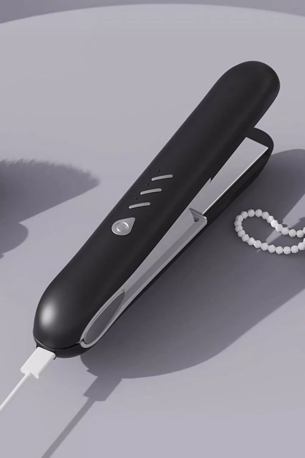 Hair straightener handle and cord detail