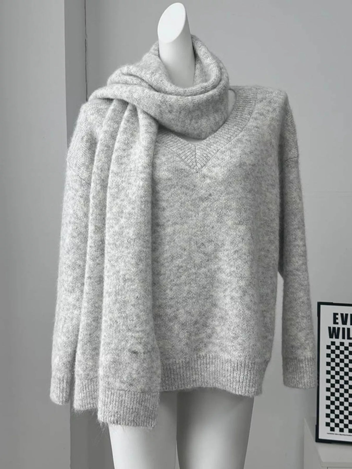 Gray oversized knit sweater styled with scarf